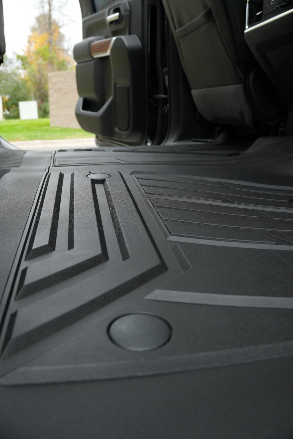 Close-up of RevTread TPE tread pattern and raised channels on the rear floor liner