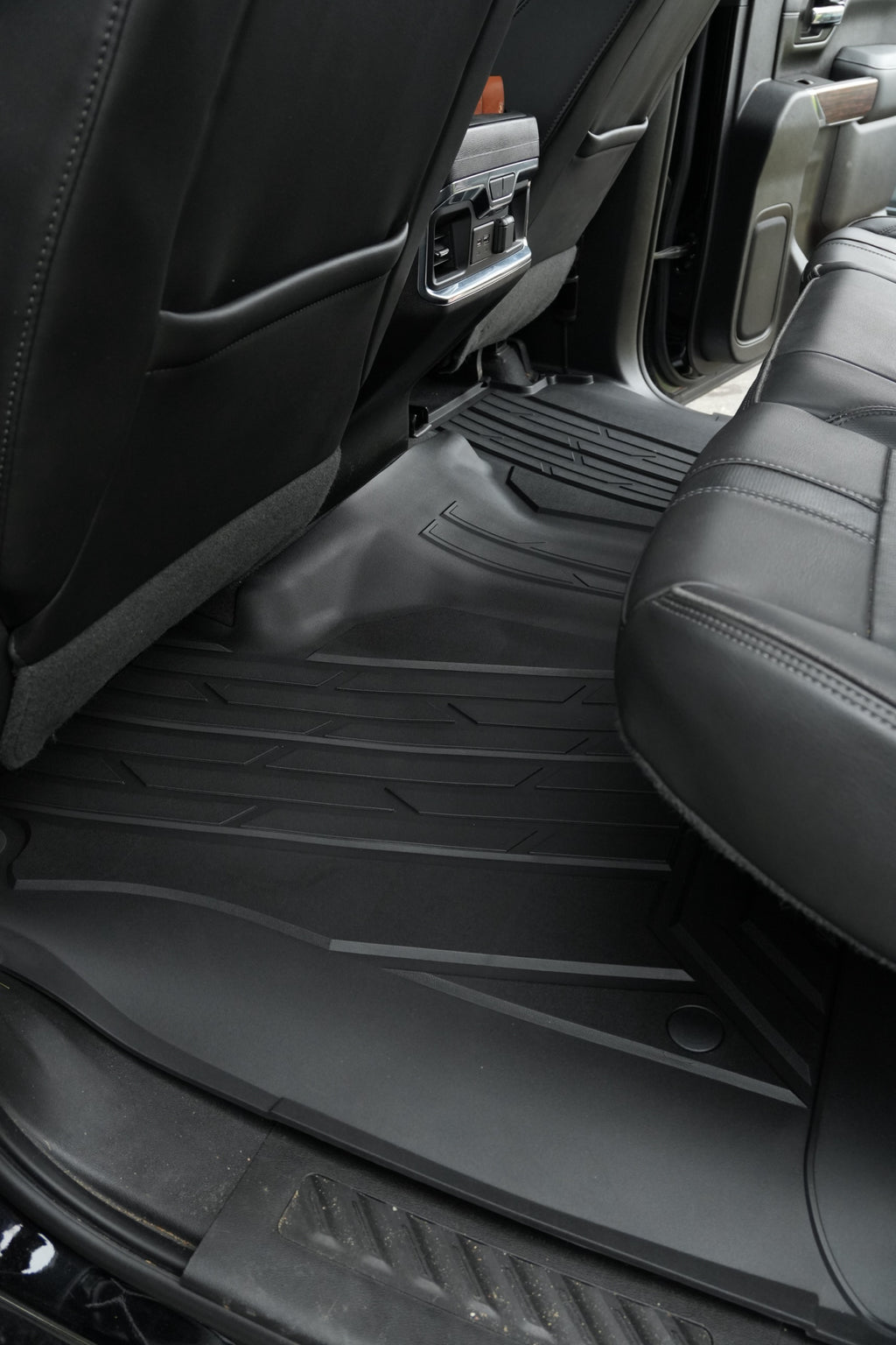 RevTread rear floor liner wrapping the center hump of a Silverado/Sierra crew cab