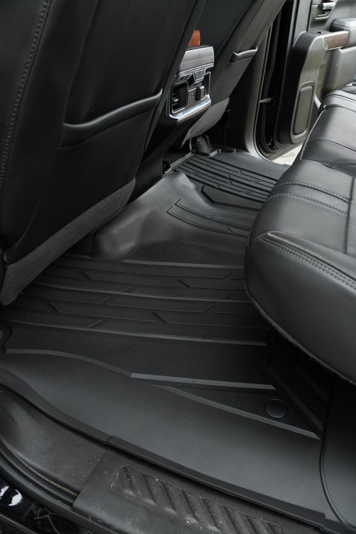 RevTread rear floor liner wrapping the center hump of a Silverado/Sierra crew cab